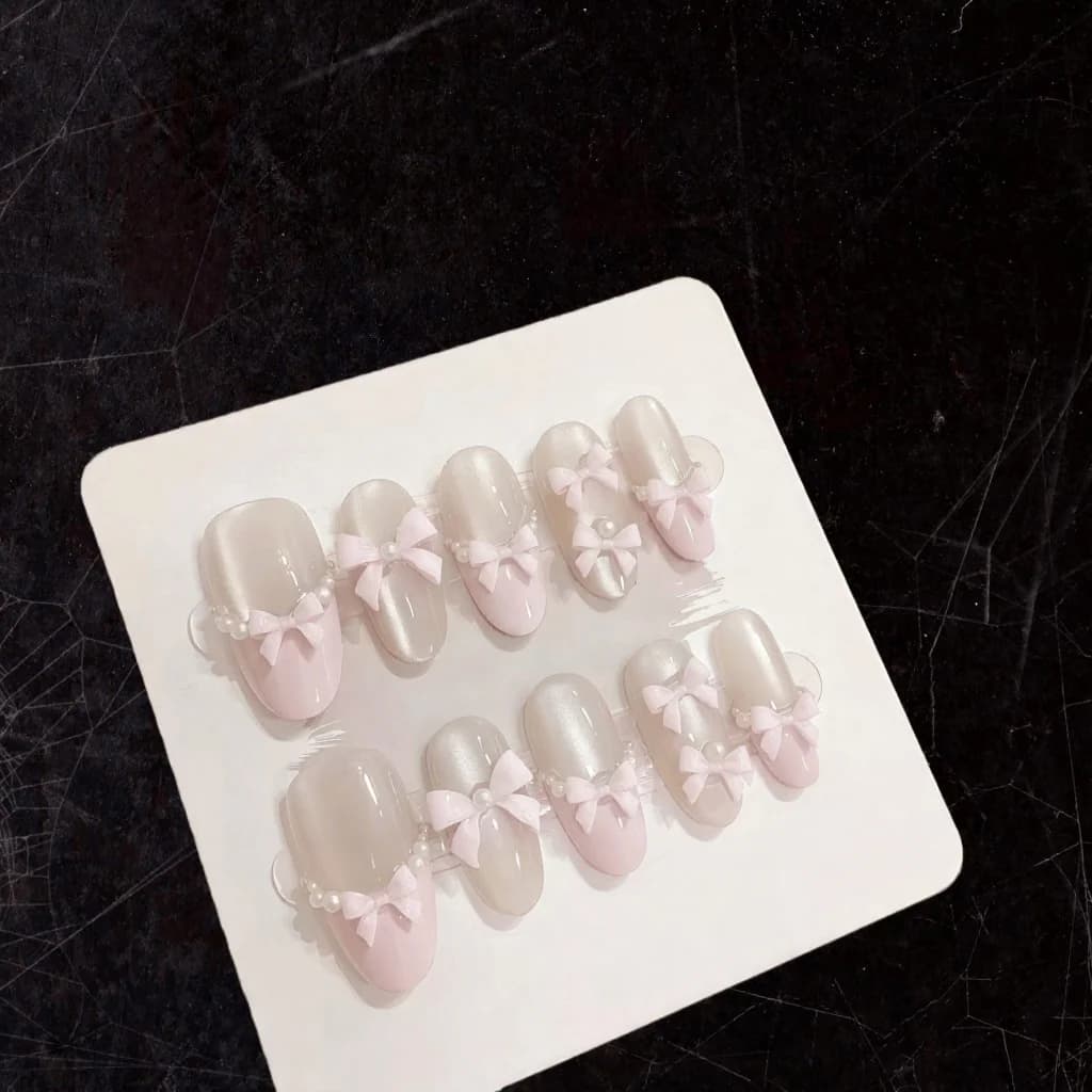 Faux ongles papillon rose œil de chat paillettes nœud