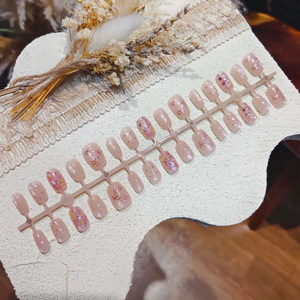 Faux Ongles Papillon Rose avec Paillettes et Nœud