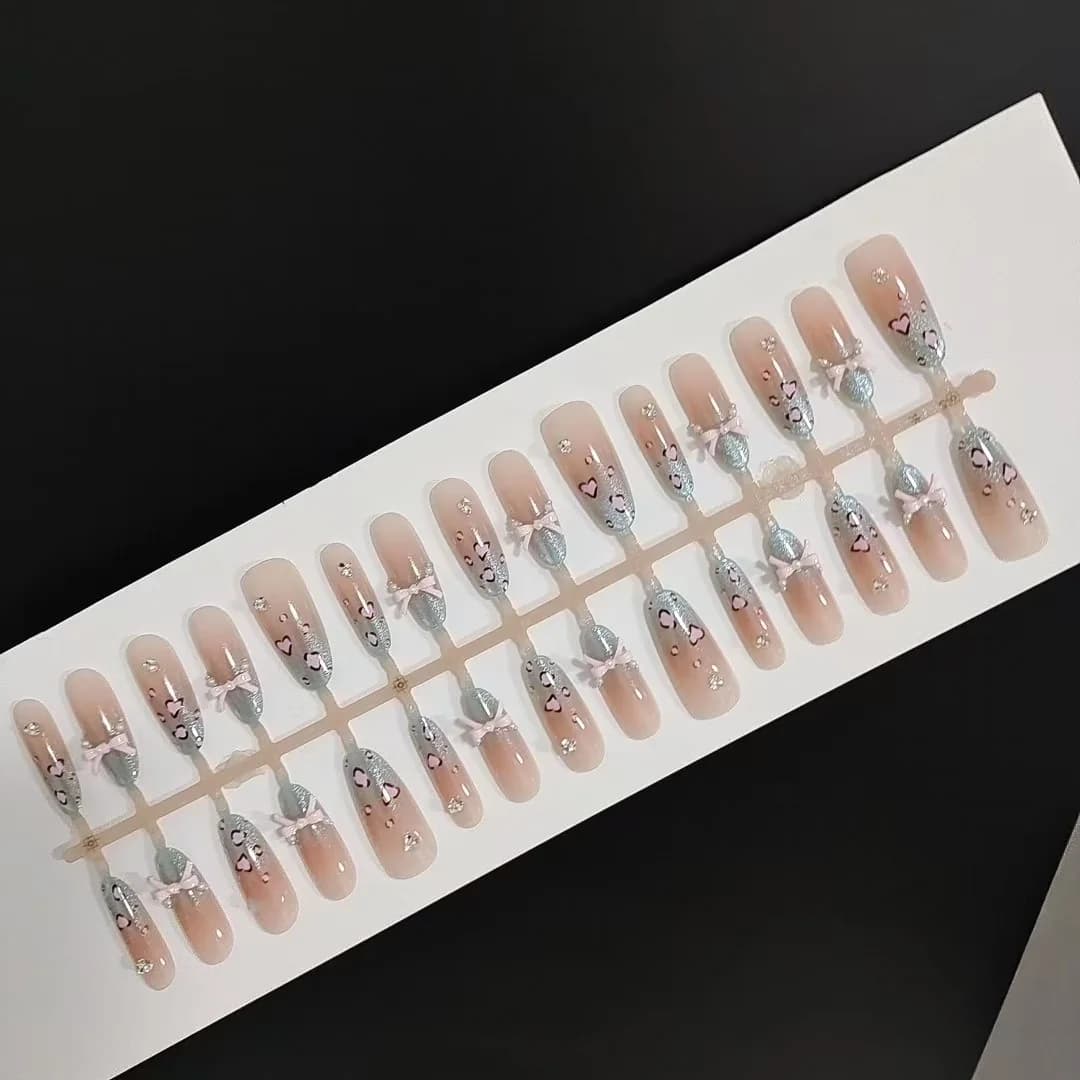 Faux ongles léopard sel de mer effet œil de chat avec nœud, forme stiletto longue